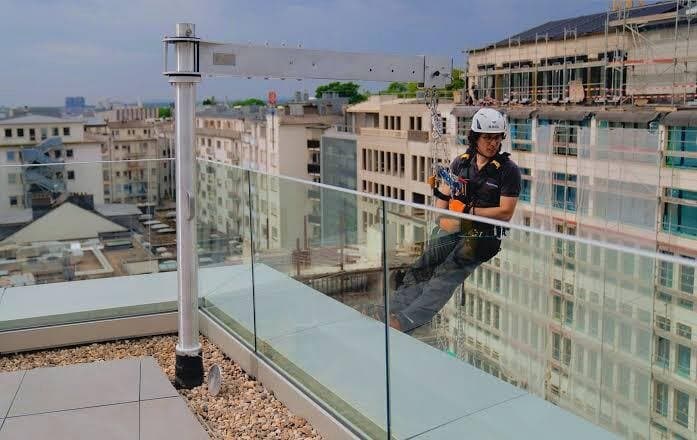Technician surveying the roof edge
