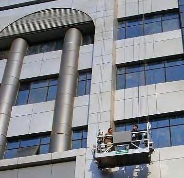 Suspended cradle working on the façade, Akhbar El Yom