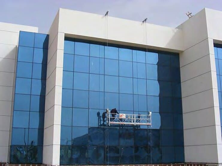 Suspended cradle working on the façade, Arab Bank — Smart Village