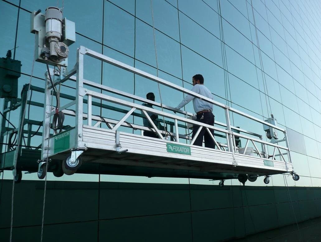 Suspended cradle working on the façade, Faisal Islamic Bank