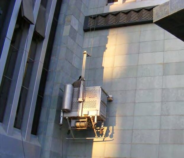 Suspended cradle working on the façade, Living In — Plot 202