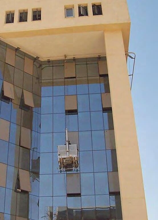 Suspended cradle working on the façade, Plot 233 — Mediterranean Contracting HQ
