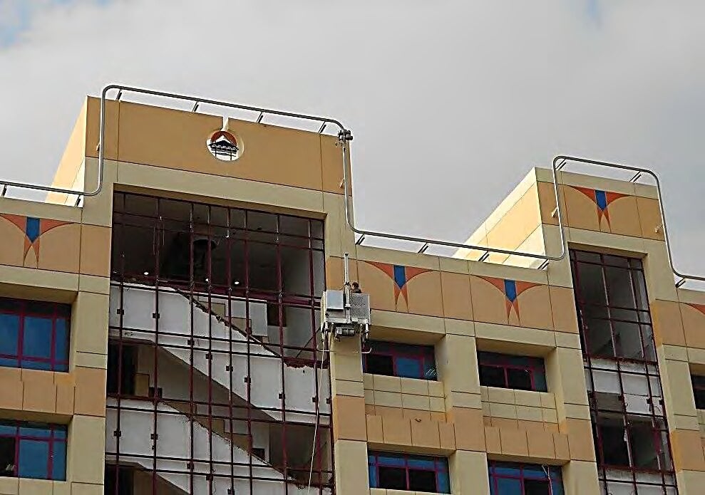 Suspended cradle working on the façade, 6 October University