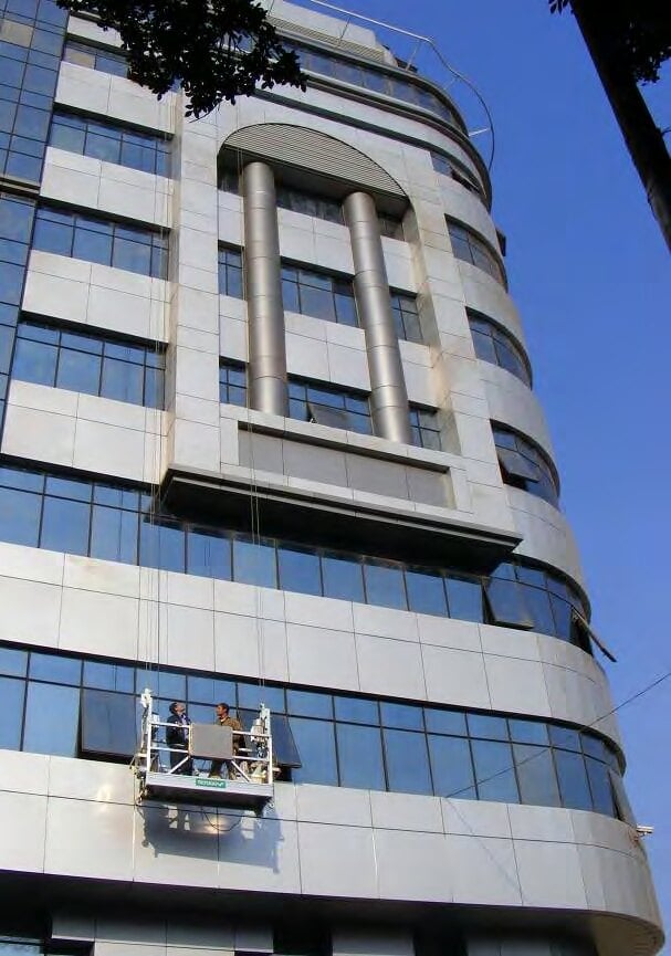 Suspended cradle working on the façade, Akhbar El Yom